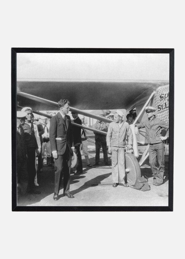 CHARLES LINDBERG IN FRONT OF THE SPRIT OF ST;LOUIS PLANE