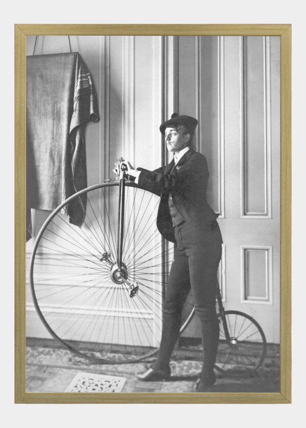 MAN POSING WITH BICYCLE