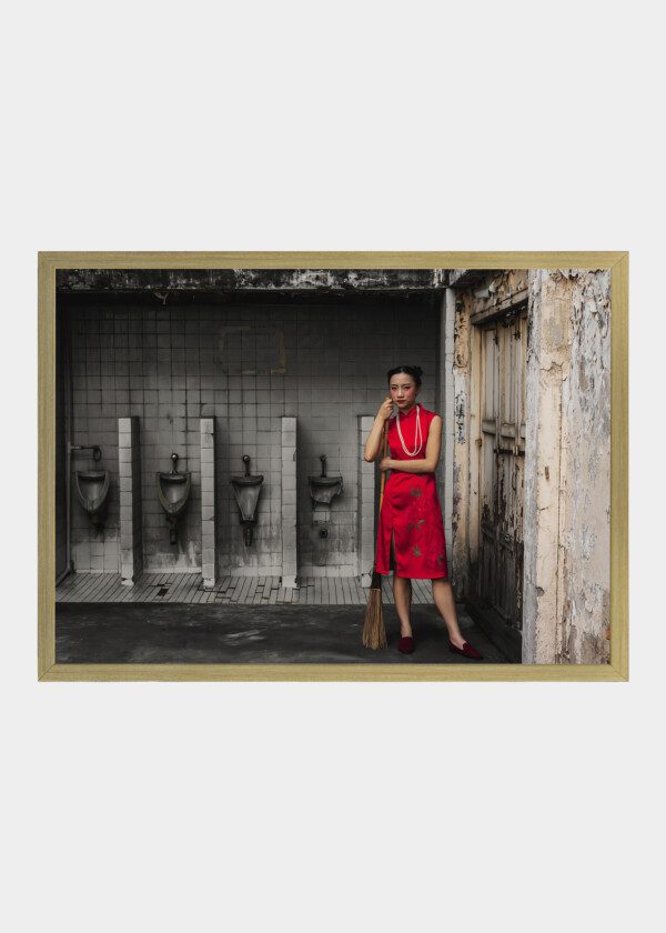 ASIAN GIRL WEARING A RED DRESS N A OLD DIRTY RESTROOM