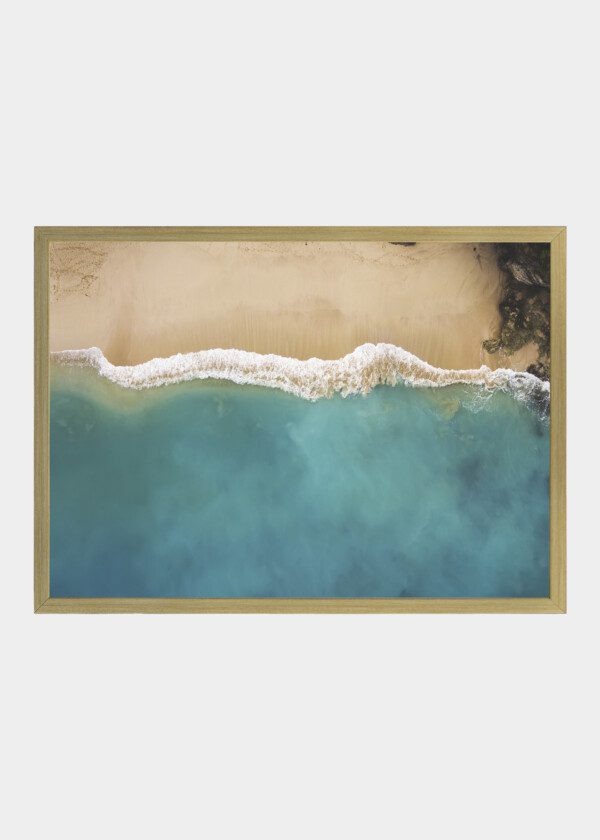 WAVES AGAINST SANDY BEACH