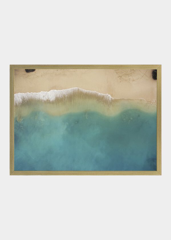 WAVES AGAINST SANDY BEACH