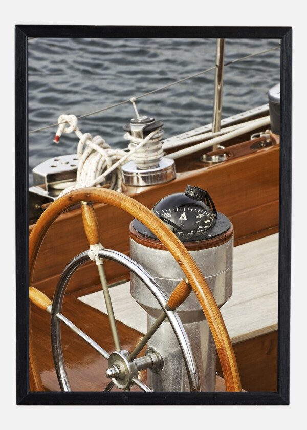 STEERING WHEEL AND COMPASS ON SAILBOAT