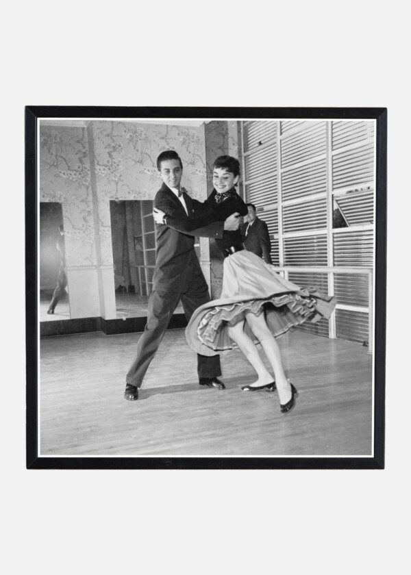 AUDREY HEPBURN DANCING WITH A MAN AT A DANCE STUDIO 1954