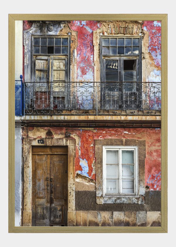 OLD WORN FACADE OF HOUSE IN PORTUGAL