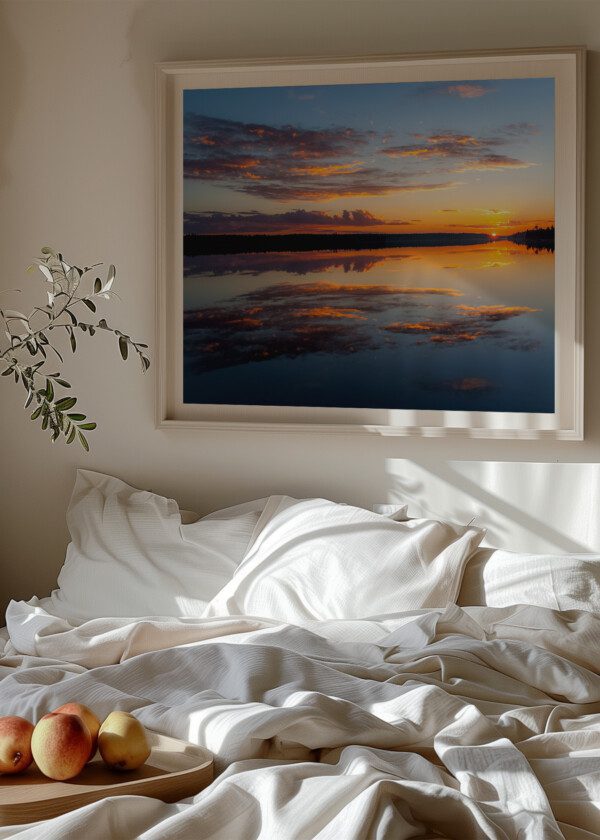 WATER REFLECTIONS AT MIDNIGHT SUN AT LAKE INARI IN FINLAND