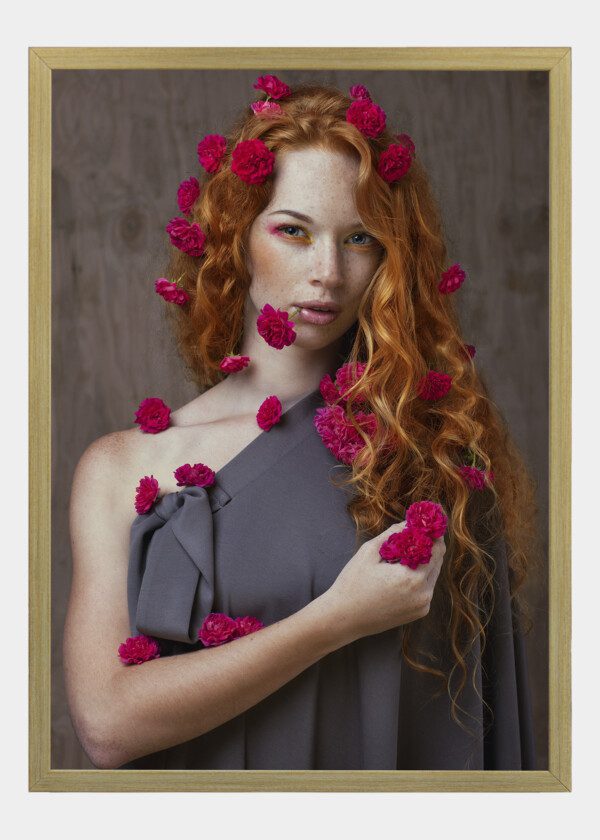 RED-HAIRED GIRL HOLDING A BOUQUET OF FLOWERS