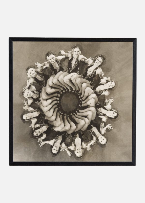 DANCERS FORMING A CIRCLE WITH THEIR LEGS