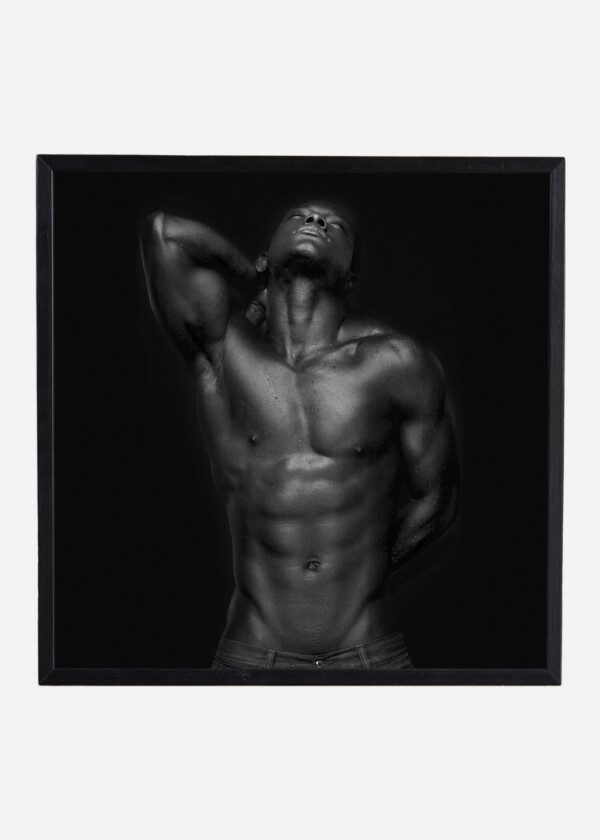 PORTRAIT OF AN ATHLETIC AFRICAN AMERICAN LOOKING UP - BLACK AND WHITE